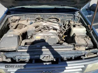 1995 Toyota T100 DX z VIN JT4VD12E0S0005758, wystawiony jako Copart lot #74018364 z przebiegiem 394 656 mil mil oraz Szkody całkowita. Historia ofert i sprzedaży dostępna na DreamBid. Obrazek 13.