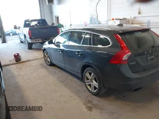 2015 Volvo V60 T5 Drive-E Premier with VIN YV140MEKXF1258073, listed as a IAAI auction lot 41428244 with 57,699 mi miles. Bid and sale history available at carsss.com. Image 3.