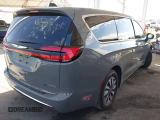 2023 Chrysler Pacifica Hybrid Touring L with VIN 2C4RC1L73PR509853, listed as a IAAI auction lot 41690872 with 83,014 mi miles and . Bid and sale history available at DreamBid. Image 4.