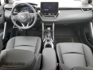 2024 Toyota Corolla Cross XLE with VIN 7MUDAAAG8RV095021, listed as a Copart auction lot 59232265 with 7,010 mi miles and Salvage title. Bid and sale history available at DreamBid. Image 8.