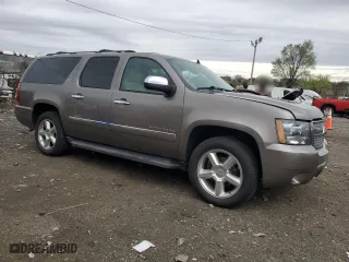 2012 Chevrolet Suburban LTZ with VIN 1GNSCKE07CR202068, listed as a Copart auction lot 51771495 with 257,988 mi miles and Salvage Title. Bid and sale history available at carsss.com. Image 4.