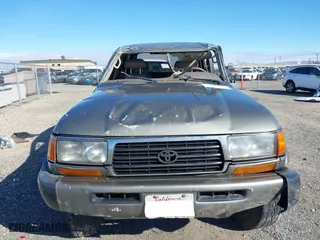 1997 Toyota Land Cruiser with VIN JT3HJ85JXV0174430, listed as a IAAI auction lot 41502690 with 300,632 mi miles. Bid and sale history available at carsss.com. Image 6.