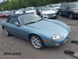 2002 Jaguar XK with VIN SAJDA42CX2NA28816, listed as a IAAI auction lot 42029672 with 130,978 mi miles and . Bid and sale history available at DreamBid. Image 1.