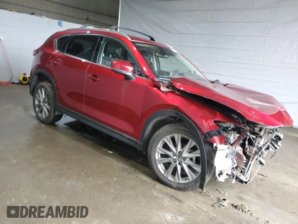 2021 Mazda CX-5 Grand Touring with VIN JM3KFBDM8M0434857, listed as a Copart auction lot 47286545 with Not Provided miles and Salvage Title. Bid and sale history available at DreamBid. Image 4.