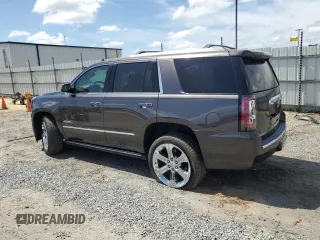 2017 GMC Yukon Denali with VIN 1GKS2CKJ3HR360319, listed as a Copart auction lot 70051014 with 127,896 mi miles and Salvage Title. Bid and sale history available at carsss.com. Image 2.