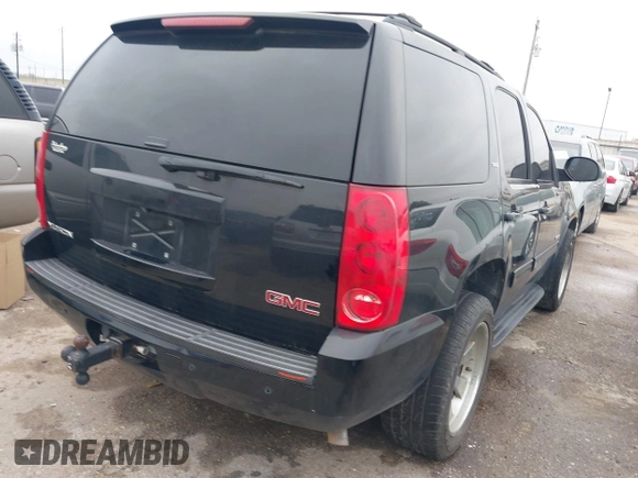2014 GMC Yukon SLT with VIN 1GKS1CE02ER207447, listed as a IAAI auction lot 41604134 with 199,417 mi miles. Bid and sale history available at carsss.com. Image 4.