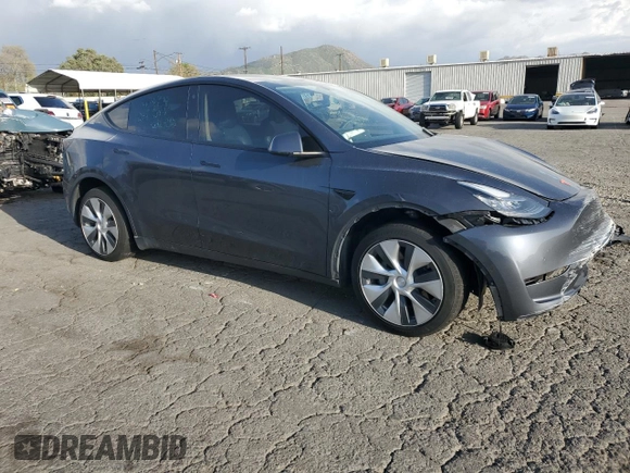 2021 Tesla Model Y Standard Range with VIN 5YJYGDED7MF109418, listed as a Copart auction lot 51590135 with 86,668 mi miles and Salvage Title. Bid and sale history available at DreamBid. Image 4.