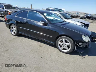 2003 Mercedes-Benz CLK 500 with VIN WDBTJ75J43F018571, listed as a Copart auction lot 72736304 with 125,780 mi miles and Salvage Title. Bid and sale history available at DreamBid. Image 4.