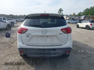 2014 Mazda CX-5 Grand Touring with VIN JM3KE4DY0E0343777, listed as a IAAI auction lot 41464395 with 126,214 mi miles. Bid and sale history available at carsss.com. Image 16.
