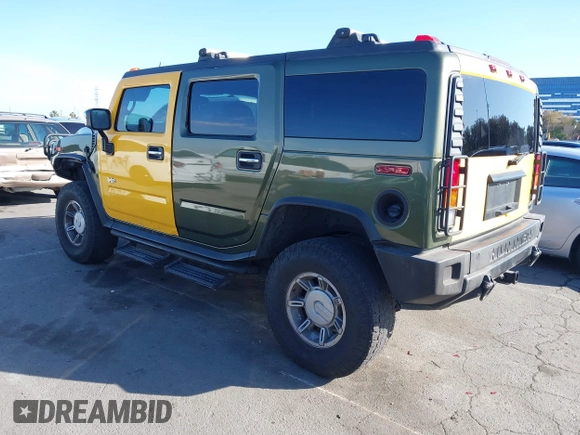 2003 Hummer H2 z VIN 5GRGN23UX3H124727, wystawiony jako IAAI lot #41697787 z przebiegiem 241 554 mil mil oraz . Historia ofert i sprzedaży dostępna na DreamBid. Obrazek 3.
