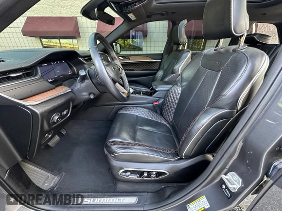 2023 Jeep Grand Cherokee Summit with VIN 1C4RJHEG2P8882566, listed as a Copart auction lot 65095905 with 59,970 mi miles and Salvage title. Bid and sale history available at DreamBid. Image 12.