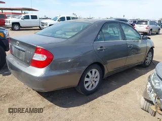 2004 Toyota Camry LE with VIN 4T1BF30K24U569209, listed as a IAAI auction lot 41988665 with 191,017 mi miles. Bid and sale history available at carsss.com. Image 4.