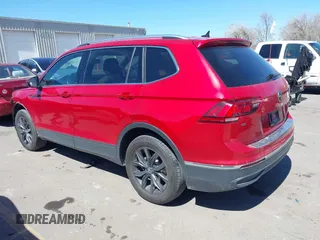 2024 Volkswagen Tiguan SE with VIN 3VV2B7AXXRM096755, listed as a IAAI auction lot 41968698 with 20,909 mi miles and . Bid and sale history available at DreamBid. Image 3.