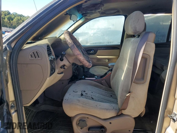 2004 GMC Envoy SLT z VIN 1GKET16S546133758, wystawiony jako Copart lot #76717674 z przebiegiem Nie podano mil oraz Szkoda całkowita • Salvage title. Historia ofert i sprzedaży dostępna na DreamBid. Obrazek 7.