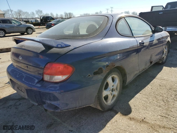 2001 Hyundai Tiburon with VIN KMHJG25F11U261457, listed as a Copart auction lot 43012635 with 165,625 mi miles and Salvage Title. Bid and sale history available at carsss.com. Image 3.