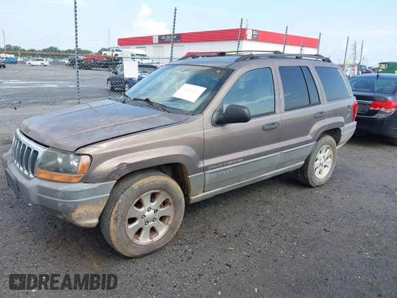 2001 Jeep Grand Cherokee Laredo z VIN 1J4GX48N51C548958, wystawiony jako IAAI lot #42460303 z przebiegiem 210 379 mil mil oraz . Historia ofert i sprzedaży dostępna na DreamBid. Obrazek 2.