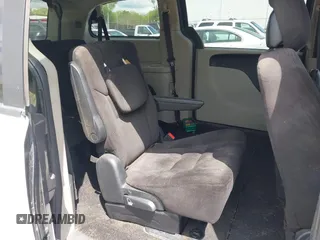 2014 Dodge Grand Caravan SXT with VIN 2C4RDGCG8ER264027, listed as a IAAI auction lot 42018350 with 311,876 mi miles and . Bid and sale history available at DreamBid. Image 8.