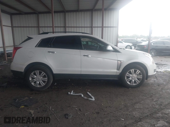 2014 Cadillac SRX z VIN 3GYFNAE32ES580480, wystawiony jako IAAI lot #42170765 z przebiegiem 148 245 mil mil oraz . Historia ofert i sprzedaży dostępna na DreamBid. Obrazek 13.