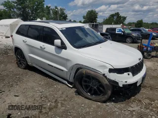 2018 Jeep Grand Cherokee High Altitude with VIN 1C4RJFCG5JC179040, listed as a Copart auction lot 61540625 with 135,310 mi miles and Salvage title. Bid and sale history available at DreamBid. Image 4.