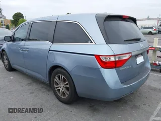 2012 Honda Odyssey EX-L with VIN 5FNRL5H66CB061847, listed as a IAAI auction lot 42162377 with 217,204 mi miles and . Bid and sale history available at DreamBid. Image 3.
