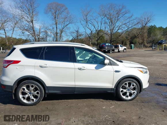 2014 Ford Escape Titanium with VIN 1FMCU9JX7EUD17335, listed as a IAAI auction lot 41302107 with 104,352 mi miles and . Bid and sale history available at DreamBid. Image 12.