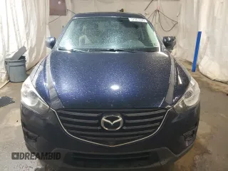 2016 Mazda CX-5 Touring z VIN JM3KE4CY4G0838908, wystawiony jako Copart lot #57961625 z przebiegiem 178 615 mil mil oraz Szkoda całkowita • Salvage title. Historia ofert i sprzedaży dostępna na DreamBid. Obrazek 5.