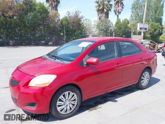 2009 Toyota Yaris with VIN JTDBT903591342243, listed as a IAAI auction lot 42104557 with 407,106 mi miles. Bid and sale history available at carsss.com. Image 6.