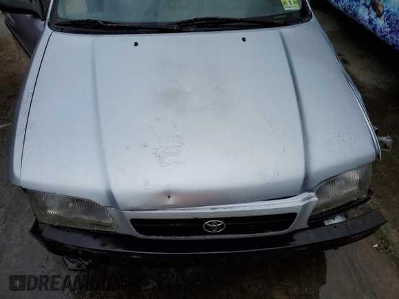 1997 Toyota Tercel CE z VIN JT2AC52L1V0227973, wystawiony jako Copart lot #56672512 z przebiegiem 301 799 mil mil oraz Szkody całkowita. Historia ofert i sprzedaży dostępna na DreamBid. Obrazek 7.