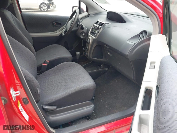 2009 Toyota Yaris with VIN JTDKT903295244022, listed as a IAAI auction lot 41615570 with 165,964 mi miles. Bid and sale history available at carsss.com. Image 5.