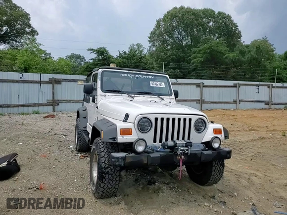 2000 Jeep Wrangler Sahara with VIN 1J4FA59SXYP760278, listed as a Copart auction lot 60402485 with 192,161 mi miles and Salvage title. Bid and sale history available at DreamBid. Image 14.