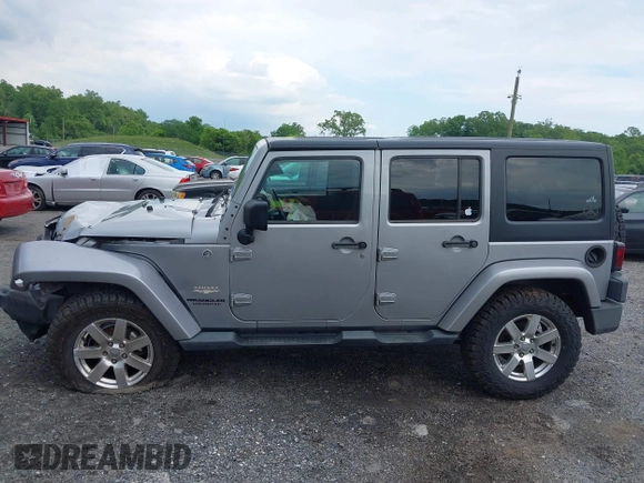 2014 Jeep Wrangler Unlimited Sahara z VIN 1C4BJWEG0EL129229, wystawiony jako IAAI lot #42380976 z przebiegiem 175 735 mil mil oraz . Historia ofert i sprzedaży dostępna na DreamBid. Obrazek 14.