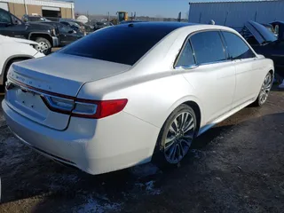 2017 Lincoln Continental Reserve with VIN 1LN6L9RP4H5609432, listed as a IAAI auction lot 41274549 with 104,742 mi miles. Bid and sale history available at carsss.com. Image 4.