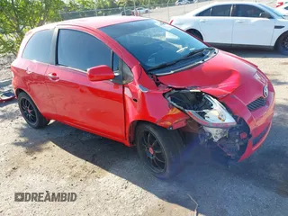 2009 Toyota Yaris with VIN JTDJT903695234623, listed as a IAAI auction lot 42027852 with 146,000 mi miles. Bid and sale history available at carsss.com. Image 1.