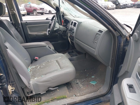 2005 Dodge Dakota Laramie with VIN 1D7HW58NX5S227633, listed as a IAAI auction lot 42122619 with 85,338 mi miles and . Bid and sale history available at DreamBid. Image 5.