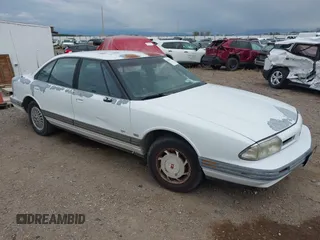 1993 Oldsmobile 88 z VIN 1G3HN53L0PH312824, wystawiony jako IAAI lot #42200714 z przebiegiem 152 810 mil mil oraz . Historia ofert i sprzedaży dostępna na DreamBid. Obrazek 1.