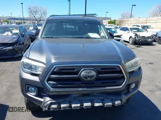 2018 Toyota Tacoma SR with VIN 5TFRX5GN1JX118441, listed as a IAAI auction lot 41870266 with 95,612 mi miles and . Bid and sale history available at DreamBid. Image 13.