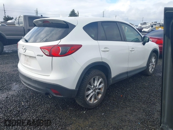 2015 Mazda CX-5 Grand Touring with VIN JM3KE4DY0F0483037, listed as a IAAI auction lot 41578222 with 102,988 mi miles. Bid and sale history available at carsss.com. Image 4.