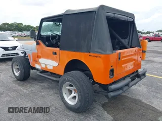 1991 Jeep Wrangler with VIN 2J4FY29SXMJ105443, listed as a IAAI auction lot 41964359 with 1,674,923 mi miles. Bid and sale history available at carsss.com. Image 3.