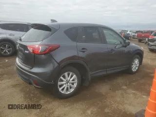 2014 Mazda CX-5 Touring with VIN JM3KE2CYXE0357272, listed as a Copart auction lot 52587565 with 139,937 mi miles and Clean Title. Bid and sale history available at carsss.com. Image 3.