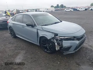2022 Honda Civic Sport z VIN 2HGFE2F55NH592929, wystawiony jako IAAI lot #42351775 z przebiegiem 58 970 mil mil oraz . Historia ofert i sprzedaży dostępna na DreamBid. Obrazek 1.