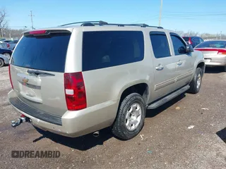 2014 Chevrolet Suburban LT with VIN 1GNSCJE07ER120130, listed as a IAAI auction lot 41792310 with 238,313 mi miles. Bid and sale history available at carsss.com. Image 4.