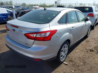 2012 Ford Focus SE with VIN 1FAHP3F20CL372391, listed as a IAAI auction lot 42100970 with 126,112 mi miles and . Bid and sale history available at DreamBid. Image 4.