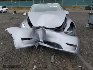 2025 Tesla Model Y Performance with VIN 7SAYGDEF2SF232223, listed as a Copart auction lot 50419235 with 0 mi miles and Salvage Title. Bid and sale history available at carsss.com. Image 12.