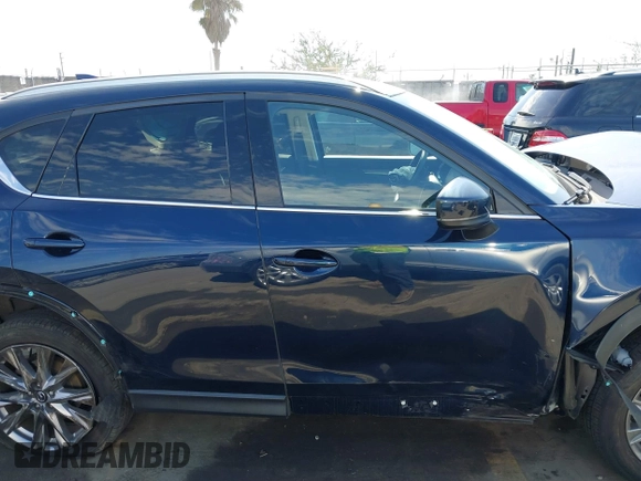 2020 Mazda CX-5 Grand Touring with VIN JM3KFADM6L1830093, listed as a IAAI auction lot 41699672 with 66,769 mi miles. Bid and sale history available at carsss.com. Image 14.