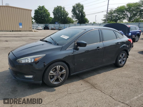 2018 Ford Focus SE z VIN 1FADP3F2XJL228407, wystawiony jako Copart lot #59254415 z przebiegiem 75 241 mil mil oraz Szkoda całkowita • Salvage title. Historia ofert i sprzedaży dostępna na DreamBid. Obrazek 1.