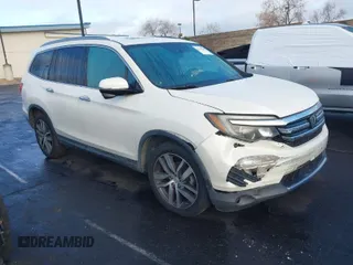2017 Honda Pilot Touring with VIN 5FNYF5H90HB011367, listed as a IAAI auction lot 41774300 with 126,012 mi miles. Bid and sale history available at carsss.com. Image 1.