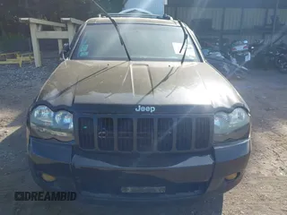 2005 Jeep Grand Cherokee Laredo z VIN 1J4GR48K65C725099, wystawiony jako IAAI lot #42509223 z przebiegiem 249 216 mil mil oraz . Historia ofert i sprzedaży dostępna na DreamBid. Obrazek 13.