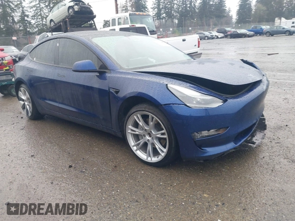 2022 Tesla Model 3 Long Range with VIN 5YJ3E1EB1NF142574, listed as a IAAI auction lot 41213900 with 127,404 mi miles and . Bid and sale history available at DreamBid. Image 1.