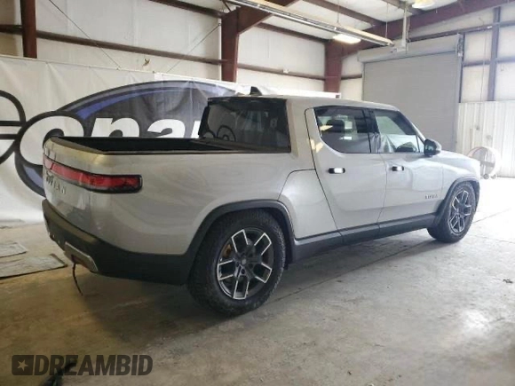 2022 Rivian R1T Launch Edition z VIN 7FCTGAAL7NN006406, wystawiony jako Copart lot #60049275 z przebiegiem 1 517 mil mil oraz Czysty tytuł • Clean title. Historia ofert i sprzedaży dostępna na DreamBid. Obrazek 4.