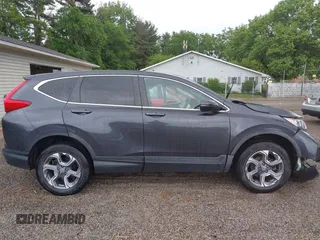 2018 Honda CR-V EX z VIN 7FARW2H50JE094132, wystawiony jako IAAI lot #42337889 z przebiegiem 59 273 mil mil oraz . Historia ofert i sprzedaży dostępna na DreamBid. Obrazek 14.